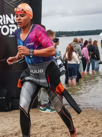 The moment you exit the water and your legs hit the sand is critical. This is T1, the first transition. All the pool work, the open water drills, it all pays off right here. My coaching focuses on making every part of your race, including transitions, strong and efficient.