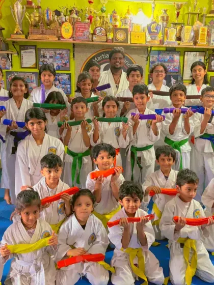 A proud moment for our students. Celebrating their new belts after a successful exam is a highlight at our academy. Each belt marks a new chapter in their martial arts journey, covering karate, taekwondo, and kickboxing.