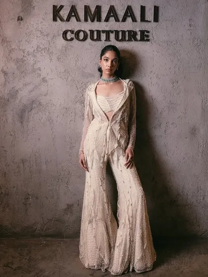 An exquisite ivory sharara set, featuring a fully embellished sharara, a structured blazer with my signature embellishment, and a coordinating bustier.