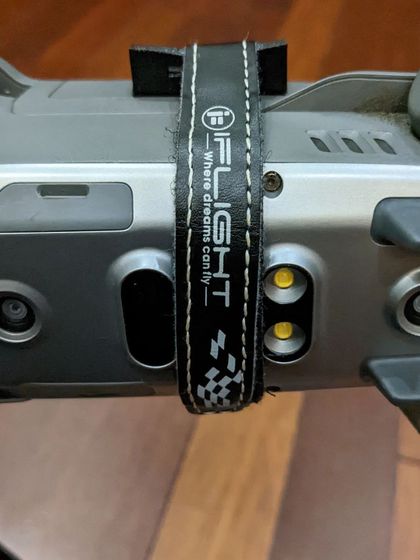 A close-up of the strap securing the FPV gear to the drone. Every part of the setup is carefully chosen to ensure reliability and safety during flight.