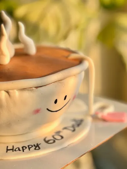 A cake steeped in love. A close-up of the custom teacup cake made for a tea-loving grandmother's 60th birthday.