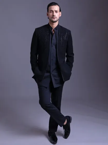 A full-length view of the open designer bandhgala, showcasing its sleek, modern silhouette. Paired with sharp trousers and dress shoes, it’s a perfect ensemble for a cocktail party or reception.