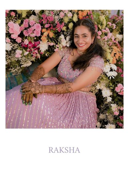 A happy bride surrounded by a beautiful arrangement of fresh flowers, showcasing her joy and the vibrant decor.