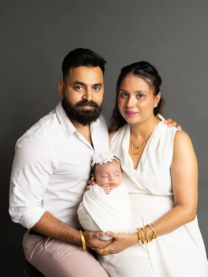 A timeless studio portrait of a new family. I offer sessions against simple, clean backdrops to create elegant and classic photos that will never go out of style.