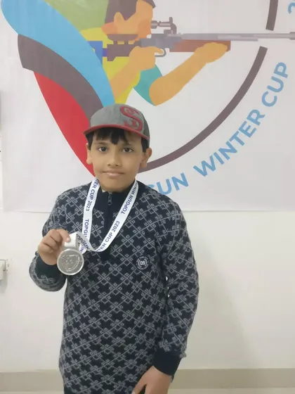 This young competitor proudly holds his silver medal won at the TOPGUN WINTER CUP 2023. Our events provide a supportive platform for kids to experience competitive shooting.
