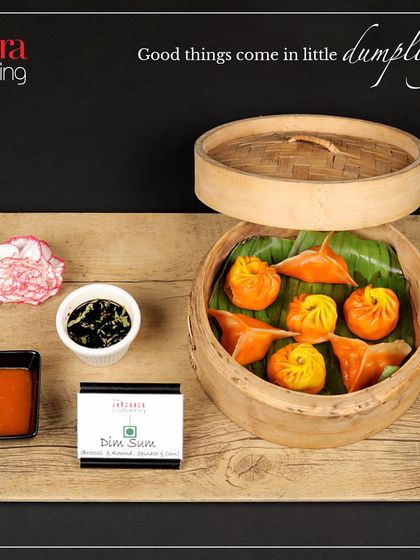 Good things come in little dumplings. We offer a variety of dim sum, including these colourful and delicately wrapped vegetable dim sums, served in a traditional bamboo steamer.