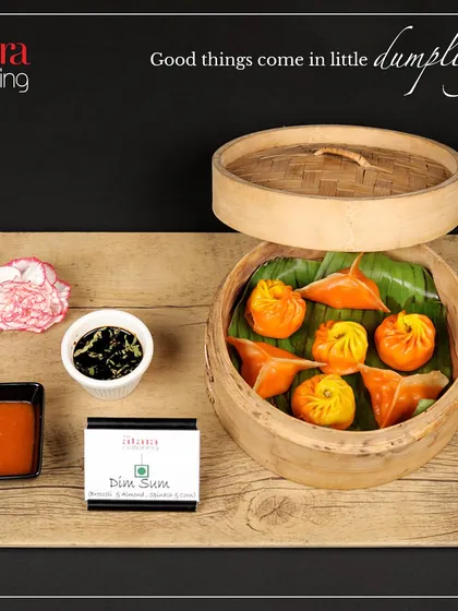 Good things come in little dumplings. We offer a variety of dim sum, including these colourful and delicately wrapped vegetable dim sums, served in a traditional bamboo steamer.