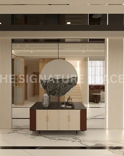 This foyer features a statement console against a backdrop of mirrored and fluted panels. We managed the complete installation, ensuring the vertical lighting strips were perfectly integrated for a dramatic entrance.