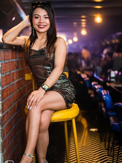 A guest posing at the bar.