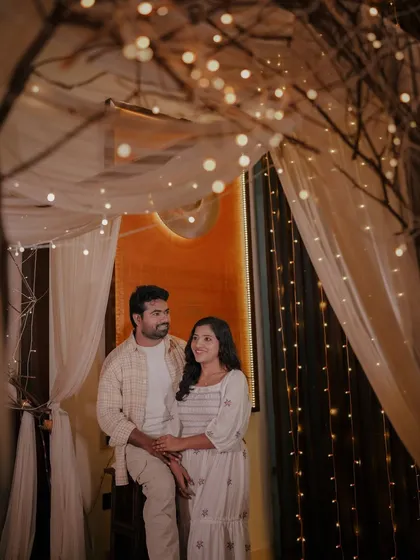An intimate photo in our indoor bed set, where the warm lights and sheer curtains create a soft and romantic mood.