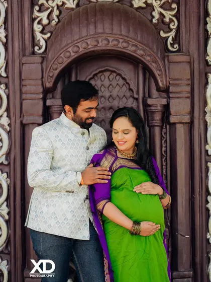 A close-up, intimate portrait of a couple sharing a quiet moment during their traditional maternity shoot.