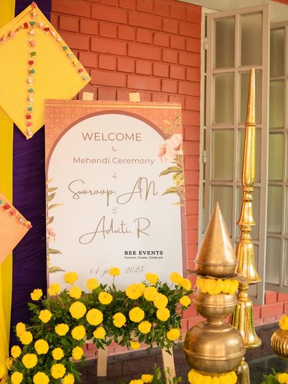 A personalized welcome sign for a Mehendi ceremony. We pay attention to every detail, including custom signage that matches the event's theme and color scheme.