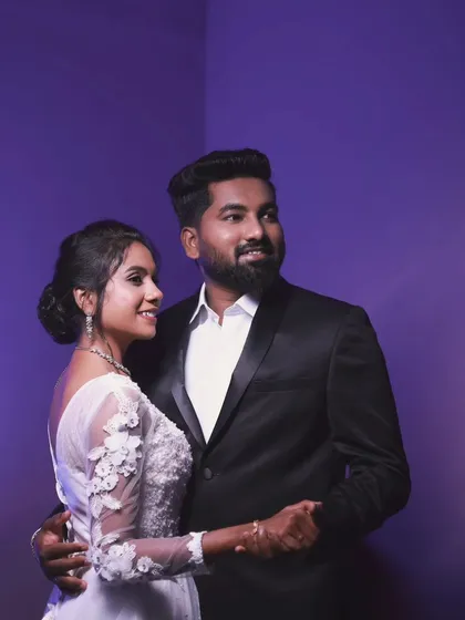 A romantic couple shot from a Christian wedding, with the bride and groom looking happy and in love.