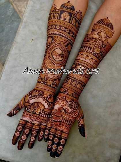 A beautiful design featuring a mix of motifs, including a doli, kalash, and peacocks.