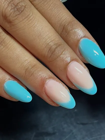 The clean lines and pop of color make this blue French manicure a standout look.