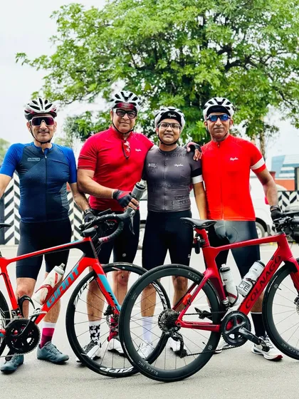 Four riders and their impressive road bikes, showcasing some of the top gear in our group.