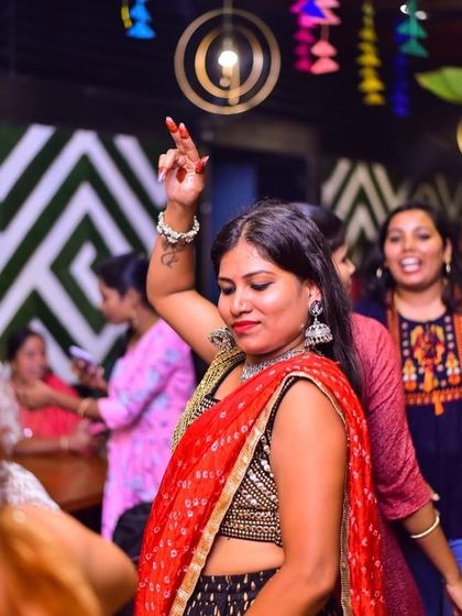 A guest dancing at the Dandiya celebration.