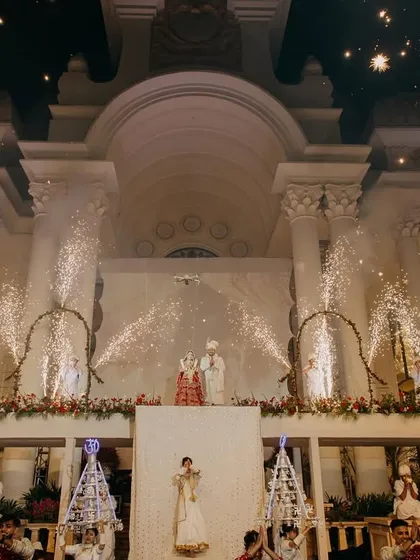 A grand wedding moment for Tushar and Samta with fireworks lighting up the palatial venue. This captures the celebratory spirit of a lavish destination wedding.