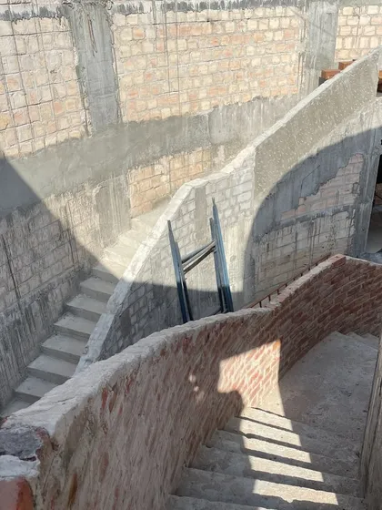 Two flights of stairs sit across from each other in the double-height space of the House of Galleries, creating a playful dialogue and dynamic compositions.