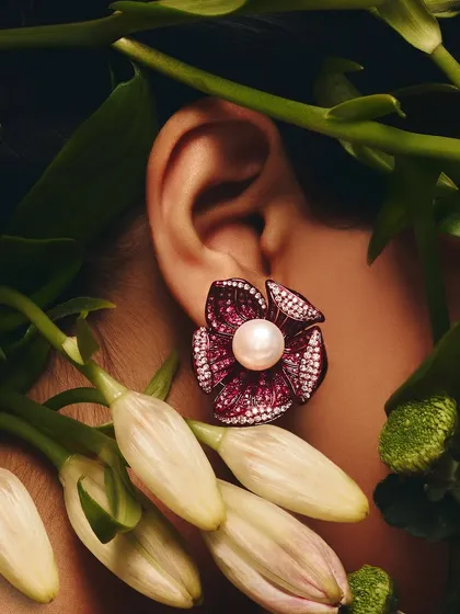 And like a flower, you bloom. These Ruby Floret earrings, with a central pearl surrounded by ruby petals, are our go-to statement makers.