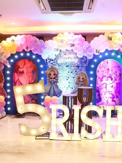 A full view of the princess party setup, including the stage, character props, and sound system for music and entertainment.
