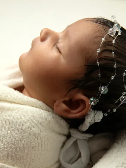 Another profile view, capturing the sweet curve of the baby's cheek and nose. These simple shots are all about celebrating their perfect newness.