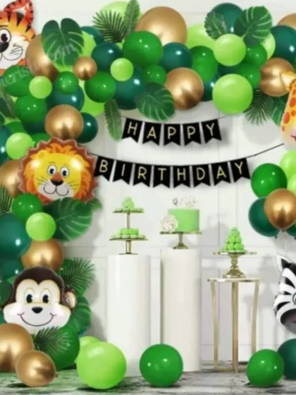 A fun and classic jungle safari theme, perfect for a child's birthday party. This setup includes a lush green and gold balloon arch, adorable animal foil balloons, and coordinated dessert stands.