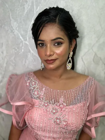 A duplicate of image 155, a close-up portrait indoors, showing the soft and blended eyeshadow and the overall polished finish of the makeup.