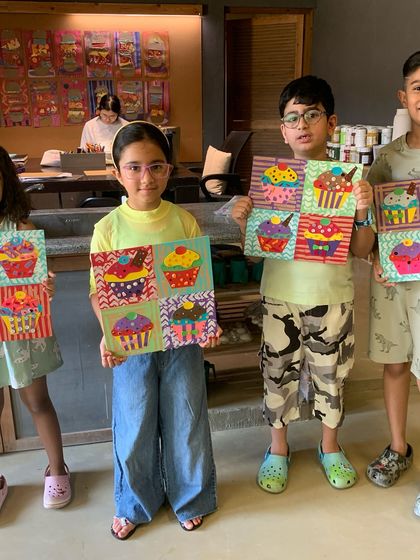 Another group of students with their fantastic cupcake pop art pieces.