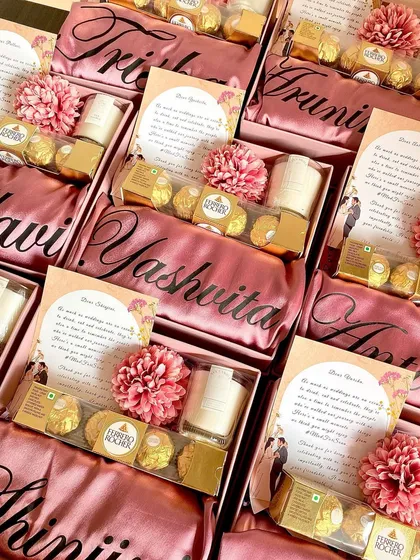 There's something so special about a personalized gift. These bridesmaid hampers feature custom satin robes with each girl's name, a scented candle, and chocolates, making for a simple yet incredibly thoughtful thank you gift.