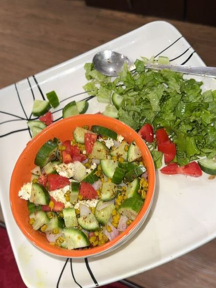 A fresh and crunchy salad with moong sprouts, cucumber, tomato, and paneer. A perfect light and nutritious meal.