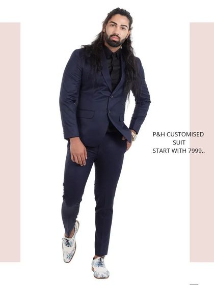 A dynamic full-length pose in the navy blue suit, showcasing its modern and confident appeal.