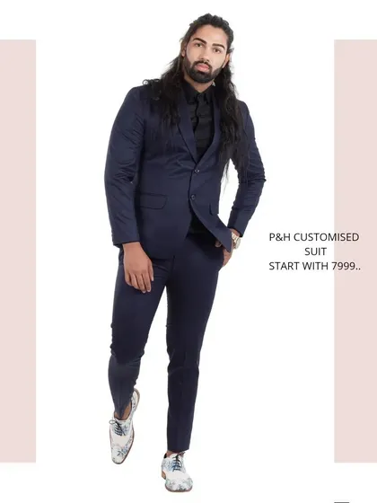 A classic two-piece suit in a deep navy blue, a versatile and essential piece for any gentleman's wardrobe.