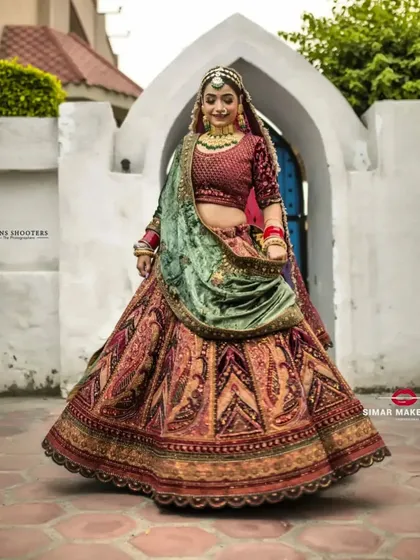 For the modern bride, I created this magnificent multi-colored lehenga. It combines traditional embroidery with a unique color palette, perfect for making a grand entrance. This is a great example of the custom designs I can create for you.