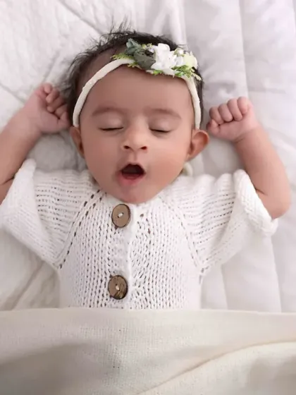 Caught in a sleepy yawn, this is the definition of newborn bliss. I capture these candid, fleeting moments during my sessions, preserving the authentic sweetness of your baby's first few weeks.