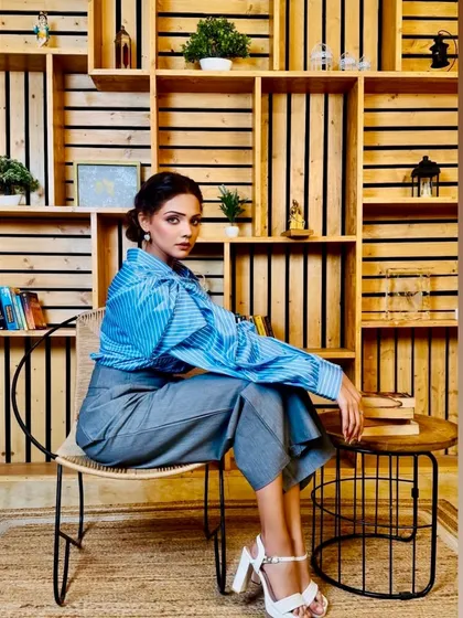 For this corporate fashion shoot, the goal was a look that felt powerful and polished. I focused on clean lines, subtly defined eyes, and a neutral lip to complement the 'power dressing' theme, ensuring the makeup enhanced the model's confident presence without overpowering the clothing.