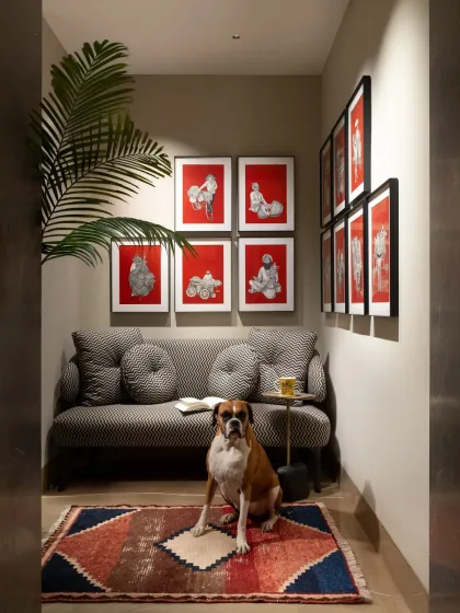 A well-designed home has space for everyone, including our beloved pets. This cozy seating alcove, featuring a chic settee from my collection, became a personal retreat for the family's boxer. It illustrates my philosophy of creating spaces that balance formal elegance with the comfort of everyday life.
