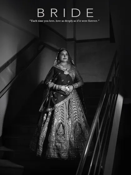 For me, bridal photography is a form of fashion portraiture. This black and white shot of a bride on a staircase uses shadow and light to create a timeless, cinematic feel. I focus on capturing the grandeur of the wedding lehenga and the quiet elegance of the moment before the ceremony.