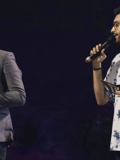 On stage with one of the winners of the drone racing competition, conducting the post-race interview and award ceremony.