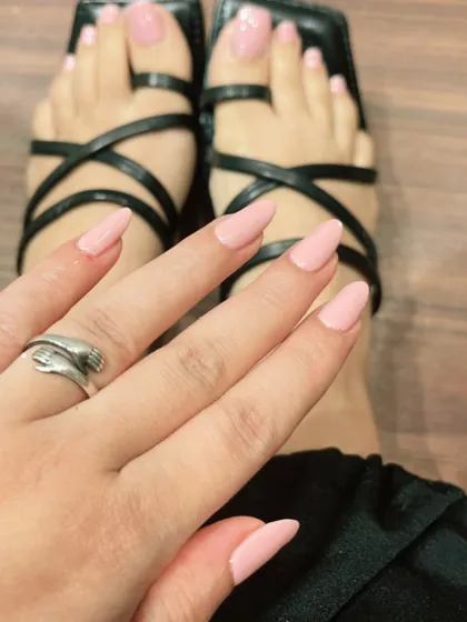 A soft, neutral pink is a perfect choice for a matching manicure and pedicure. It's a clean, polished, and go-with-anything look.