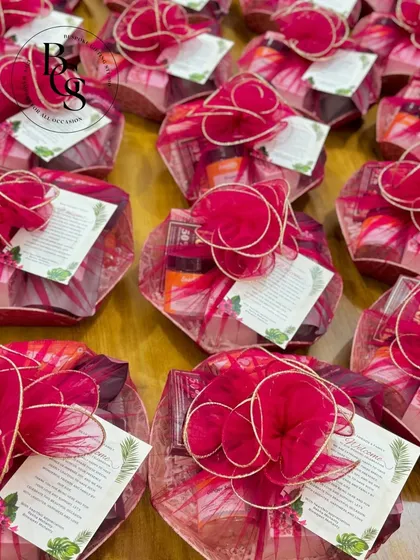 These wedding in-room hampers are designed to be a warm welcome for your guests. Wrapped in vibrant pink fabric, they are filled with thoughtful items to make their stay comfortable and memorable.