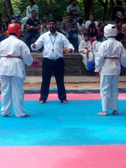 Two young fighters face each other before the match. Respect for your opponent is a fundamental part of Budo karate.