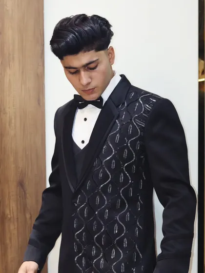 A closer look at the asymmetrical embroidered lapel on this black tuxedo. This kind of custom detail is what makes my suits unique.