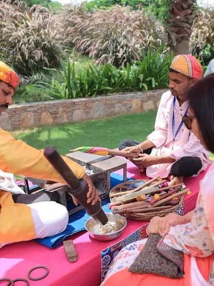An interactive station where guests could get traditional lac bangles made live. This not only provides entertainment but also serves as a beautiful, customized wedding favor for guests to take home.