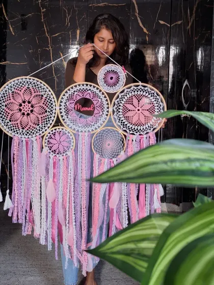 This large pink cluster dreamcatcher, personalized with the name 'Meenal', is designed to radiate positivity. Its balance of warmth and elegance creates a cozy and inspiring atmosphere on any wall.