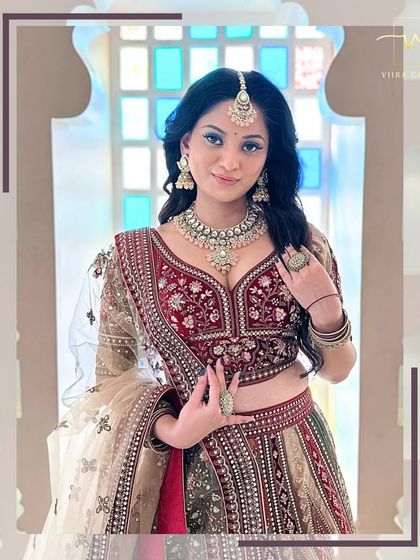 A beautiful close-up of the bride, focusing on the exquisite detailing of the blouse and the stunning rental jewelry.