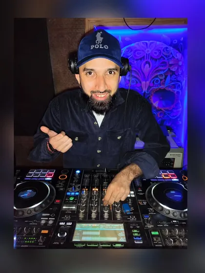 A thumbs-up from behind the decks. I love what I do, and I bring that positive energy to every single event.