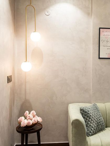 Another view of the globe pendant in the office waiting area, showing how it creates a welcoming and stylish first impression.