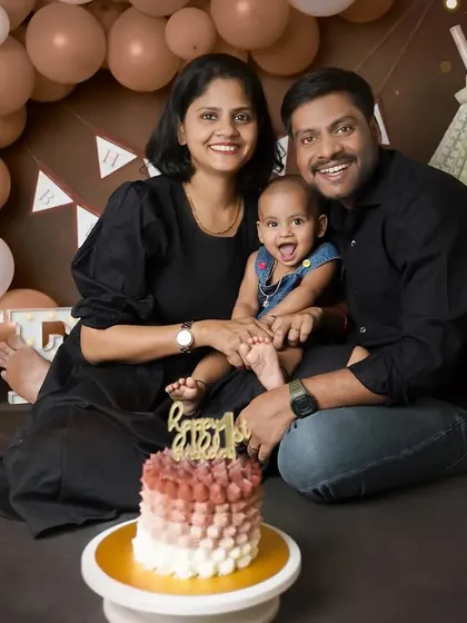 The whole family joins in for the first birthday celebration. This shot was taken right before the cake smash, capturing the excitement and joy of the big day.