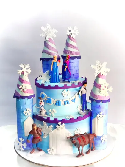 An Elsa and Anna castle cake. This design features the iconic ice palace and all the main characters from the movie.